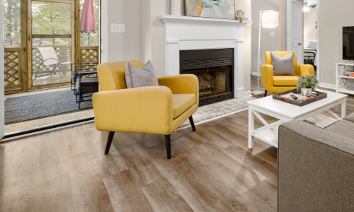 A fully furnished living room with a wood floor.