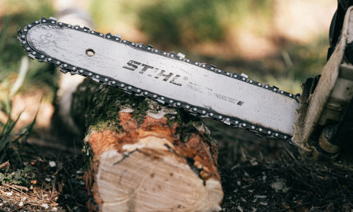 A close-up of a Stihl chainsaw.